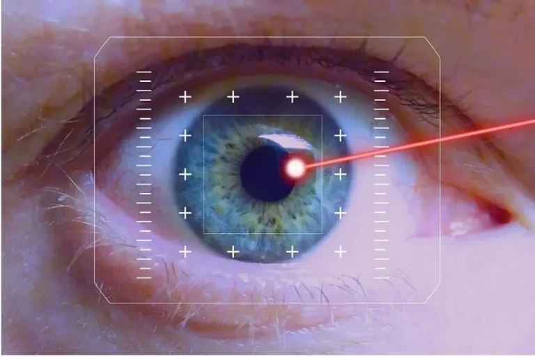 Close-up of a human eye with a digital scanning interface and a red laser targeting the pupil, representing advanced eye diagnostics or surgery.